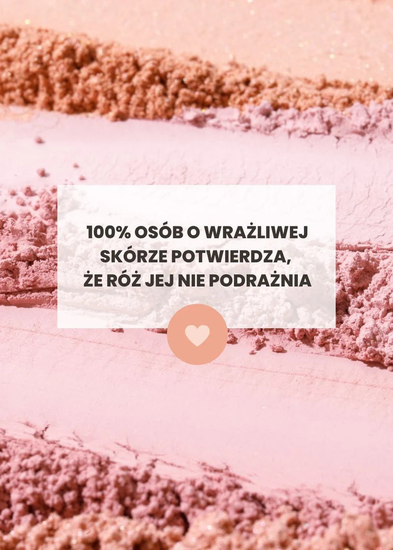 Różowe tło z różów mineralnych Annabelle Minerals z tekstem 100% osób z wrażliwą skórą potwierdza, że róża jej nie podrażnia i ikoną serca
